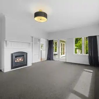 This beautifully presented three-bedroom, two-bathroom home offers a premium standard of living in one of the most desirable locations near the city. - Photo 1