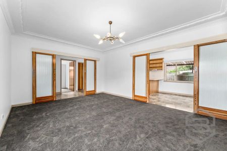 “Renovated Family Home with Secure Yard and Ample Parking” - Photo 4