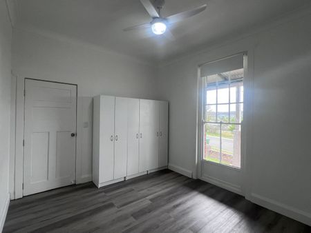 Spacious 3-Bedroom Home with Sunroom and Garden Shed - Photo 3