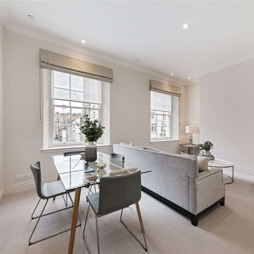 A modern two bedroom apartment situated on the first floor of a period building. - Photo 1