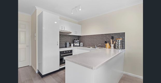 Coastal Convenience and Modern Comfort! - Photo 1