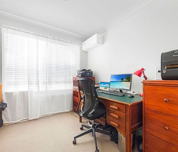 Centrally Located Modern Home with Spa and Additional Study! - Photo 1