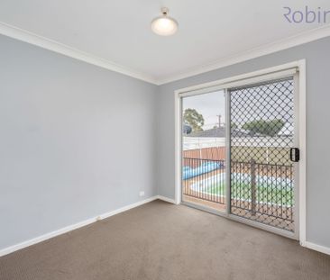 Spacious Family Home with Pool, Double Shed & Ample Parking - Photo 2
