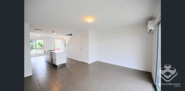 Peaceful Three-Bedroom Townhouse in Convenient Bundamba Location - Photo 1