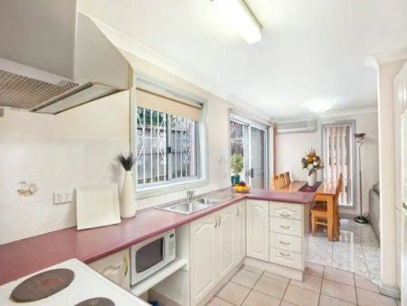 “Three Bedroom Well Maintained Townhouse” - Photo 2