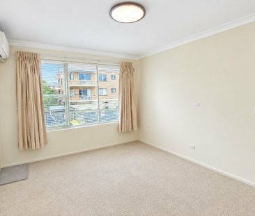 FRESHLY PAINTED TWO-BEDROOM APARTMENT WITH DOUBLE PARKING - Photo 2