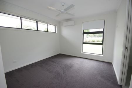 Set in the exclusive "Korora Beach Estate", this home ticks all the boxes! - Photo 2