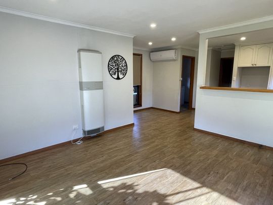 This charming brick unit is perfect for those seeking a low-maintenance lifestyle. Features include: - Photo 1