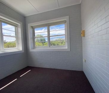 -Centrally located large two bedroom unit with sun room. - Photo 6