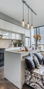 Bloor E/Ted Rogers Way-Open Bright 1Bd+Den w Murphy Bd &Cabinetry - Photo 3