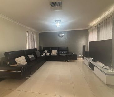 Elegant Home with Modern Amenities and Secure Garage - Photo 1