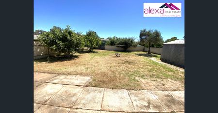 Charming 3-Bedroom Family Home with Spacious Backyard - Photo 2