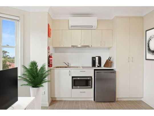 Centrally Located Designer Studio With Kitchenette and All Utilities Included - Photo 1