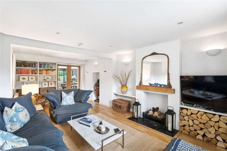 A beautifully presented and thoughtfully extended village home, offering a particularly impressive open plan living space, set within a mature and private garden. - Photo 2