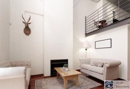 Stunning tri-level townhouse in historic warehouse conversion - Photo 2