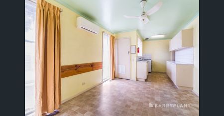 Spacious Retro Charm with Modern Convenience in Prime Suburban Setting - Photo 4