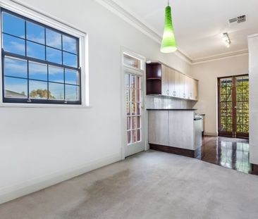 Top-Floor Living with Park Views & Incredible Convenience - Photo 1