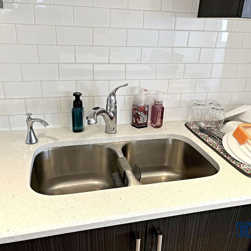 10799 Cityscape Drive NE | Townhouse | 3-bedroom, 2.5-bathroom | Double Garage - Photo 1
