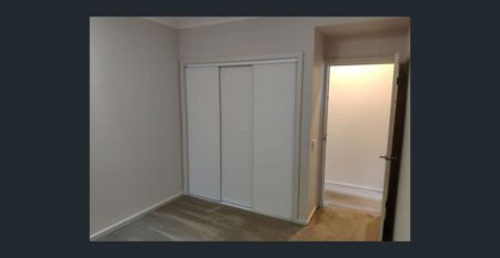 Modern Three-Bedroom Townhouse with Stylish Living in Prime North Melbourne Location - Photo 2