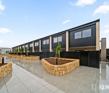 Stylish Split Level 2 Bedroom Home with Triple Garage - Photo 2