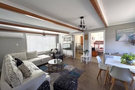 Live the Coastal Lifestyle – Furnished 4-Bedroom Retreat Steps from White Beach - Photo 2