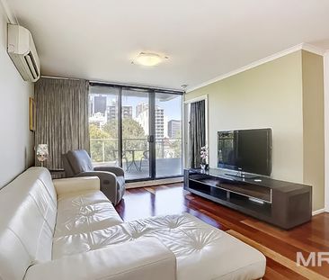 Stylish fully furnished apartment with huge entertainers balcony - Photo 1