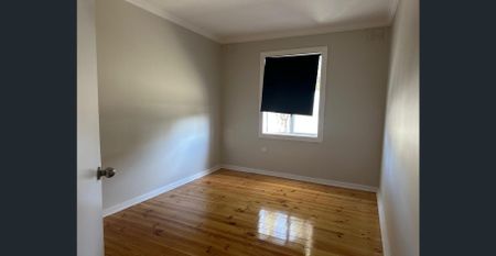 Family Home with Modern Comforts and Spacious Backyard - Photo 3