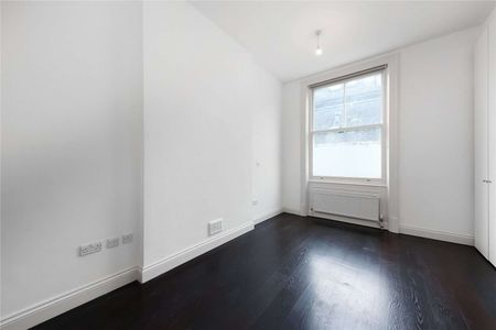 A ground floor apartment in a recently refurbished building benefitting from two bedroom and two bathrooms with an exceptional reception room and wooden flooring throughout. - Photo 2