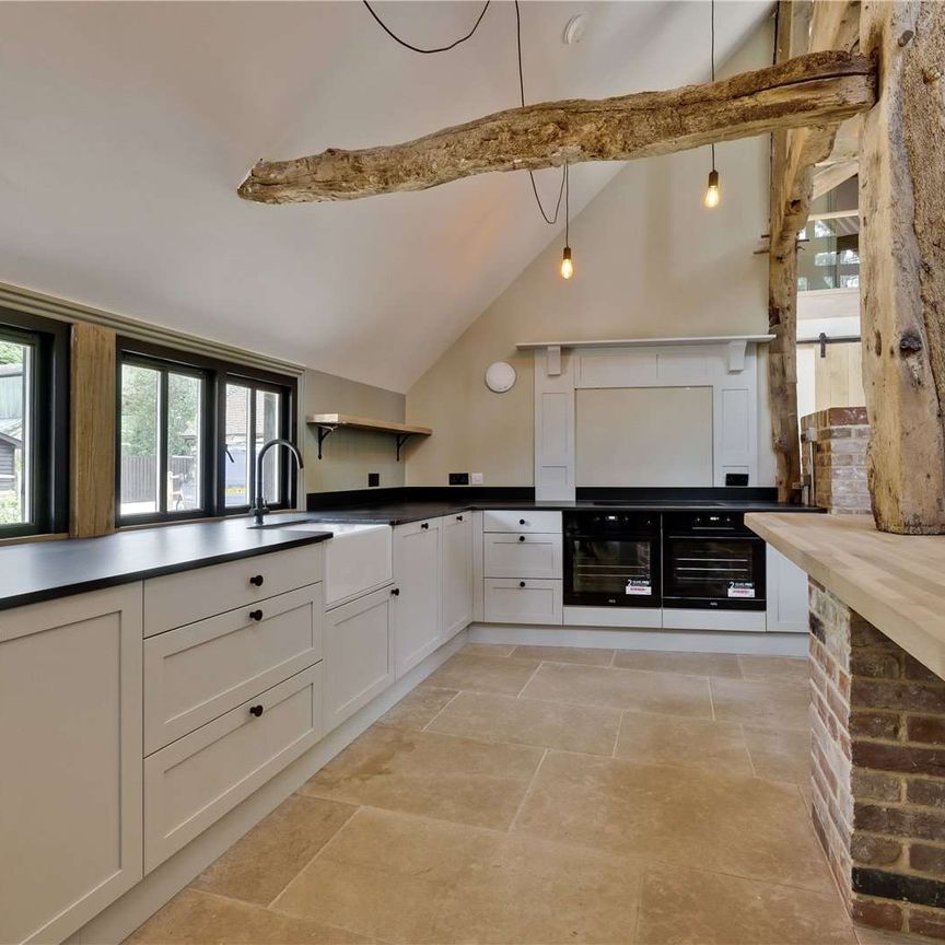 An exceptional barn conversion, combining character and contemporary design in the village of Churt. - Photo 1