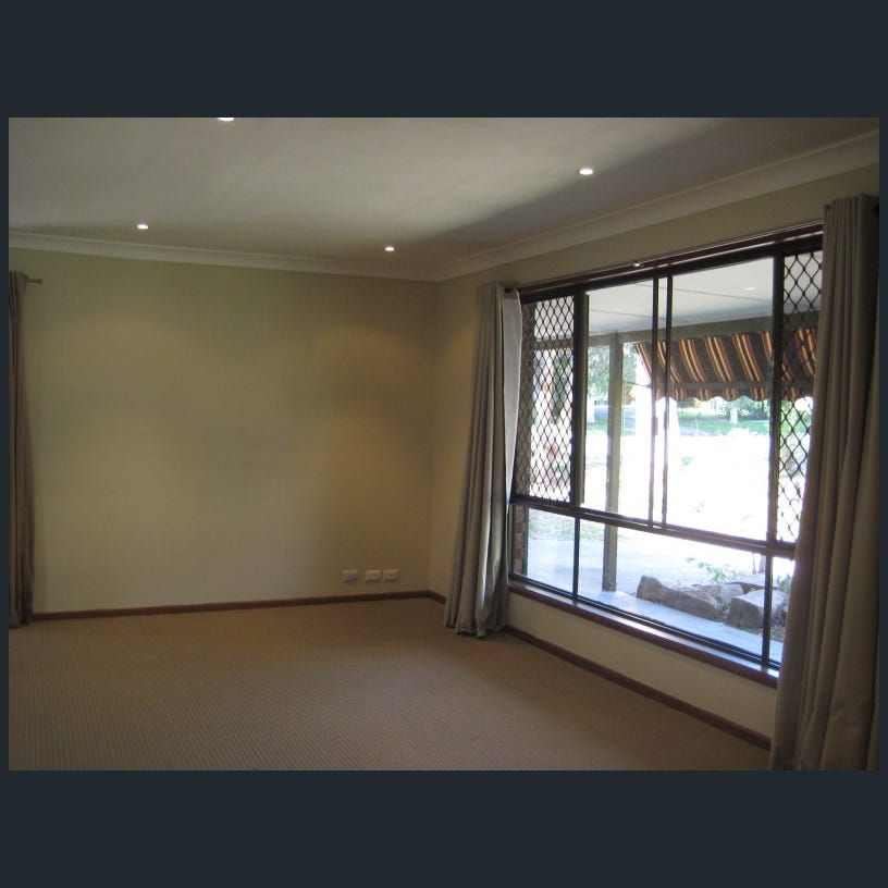 Easy-Care Living with Generous Outdoor Space in Sought-After Belmont - Photo 1