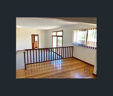 Double storey home with multiple living spaces - Photo 4