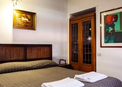 Attic-Monti: 1-6 month rentals. Spacious, furnished 3 Bedroom, 2 bath, living room, dining room, study and large panoramic terrace. Bright, silent, located in well kept Palazzo d’Epoca with elevator and doorman. Near transport and Metro.