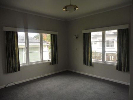 This tidy home at 16 MacDiarmid Road offers three spacious bedrooms, a modern kitchen, open-plan living, and a heat pump for year-round comfort. - Photo 5