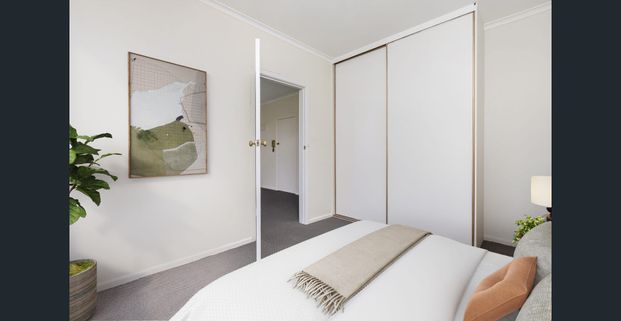 Stylish Two-Bedroom Gem with Secure Parking in a Winning Location! - Photo 1