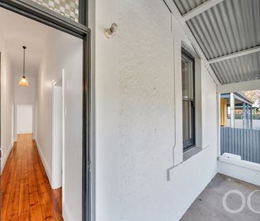 Open the Door to Coastal Charm with Modern Comfort - Photo 6