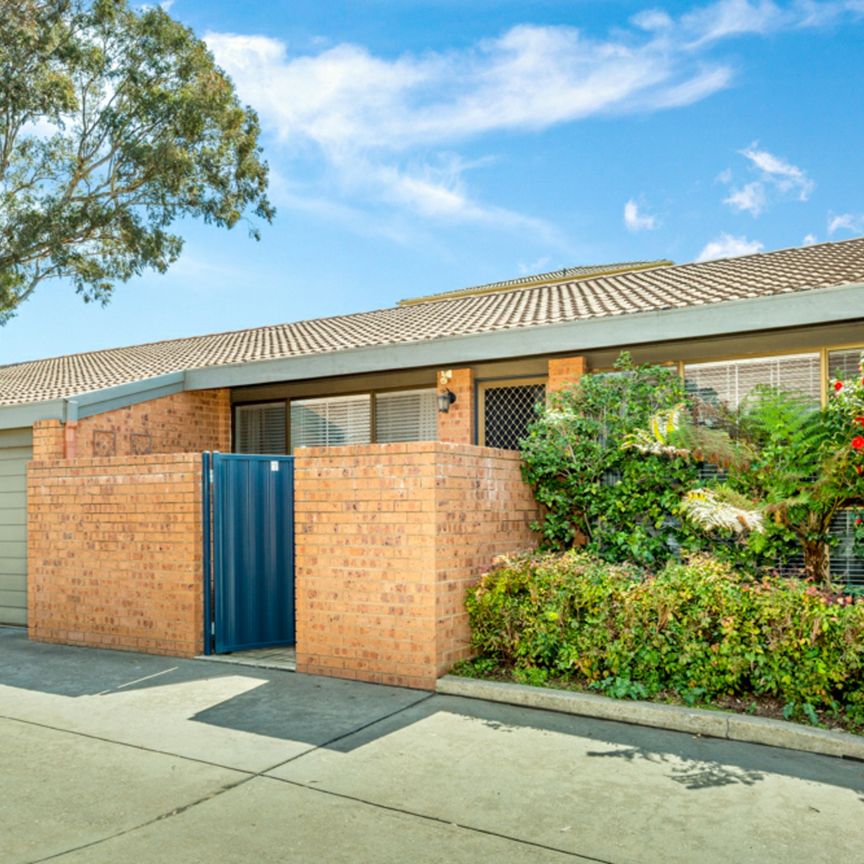 Fantastic Single Level Two Bedroom Townhouse with Garage - Photo 1