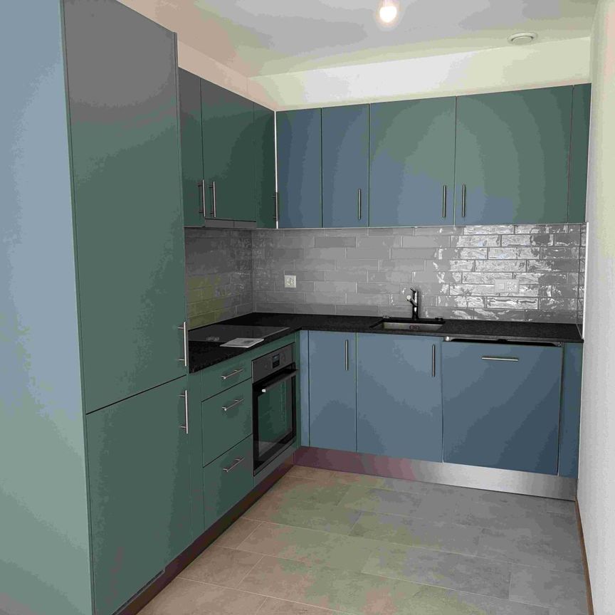 Magnifique appartement de 2.5 pièces au 1er étage d'un immeuble neuf avec balcon - Photo 1