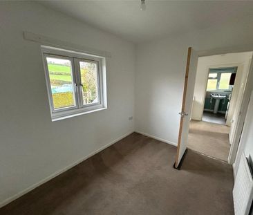 A three-bedroom semi-detached cottage located in the village of Lla... - Photo 3