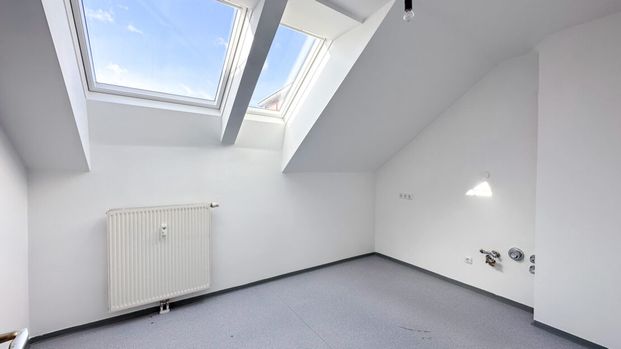 Helle 3-Zimmer-Dachgeschosswohnung mit Loggia - Foto 1