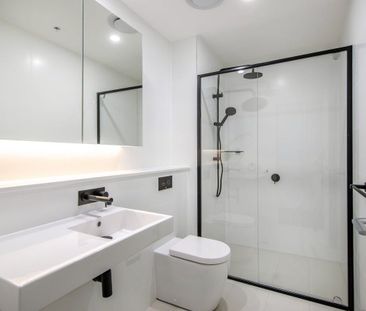 Sleek & Secure Apartment Close to Everything - Photo 4