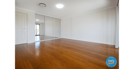 Modern 4-Bedroom Family Home in Prime Girraween Location - Photo 5