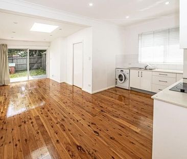 Beautifully Updated 3-Bedroom Semi with Secure Garage & Ample Storage - Photo 4