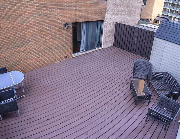 Corner unit with a HUGE patio | 207 - 718 12 Ave SW, Calgary - Photo 1