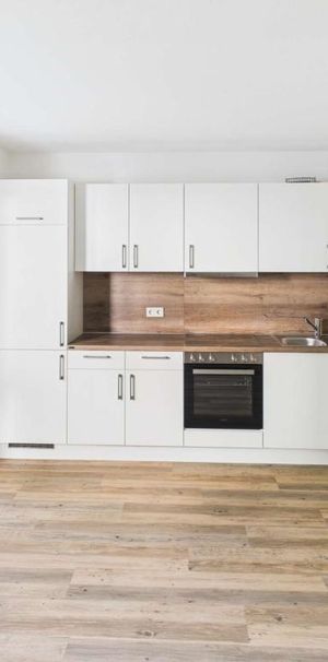 Moderne 1-Zimmer-Wohnung mit Einbauküche und Terrasse - Foto 1