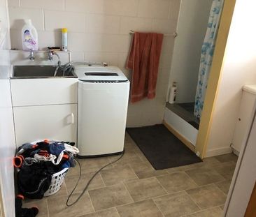 Tidy and spacious, this one-bedroom upstairs flat sits in a quiet b... - Photo 1