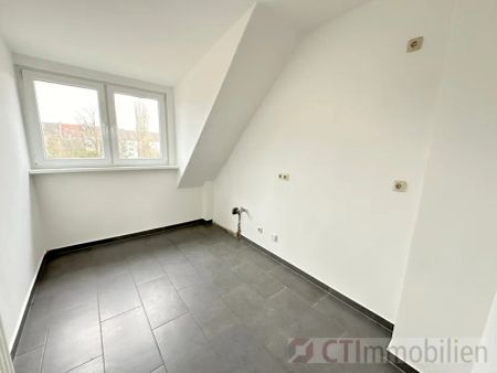 Moderne Dachgeschosswohnung in zentraler Lage - Foto 5