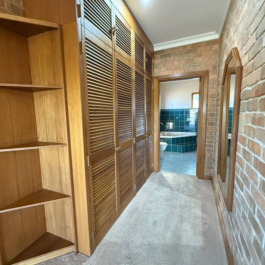 Spacious Family Home with Breathtaking Bushland Views and Flexible Living - Photo 1
