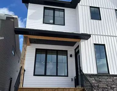 STUNNING BRAND NEW 3 BEDROOM PLUS 2.5 BATH AND A BONUS ROOM—-CREEKSTONE SW | 21214 Sheriff King Street Southwest, Calgary - Photo 1