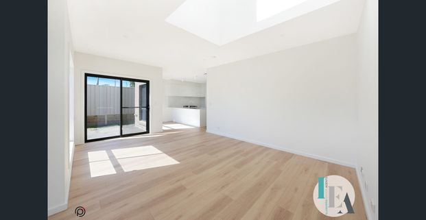 Modern Living at Its Finest – Brand-New, Stylish Townhouse - Photo 1