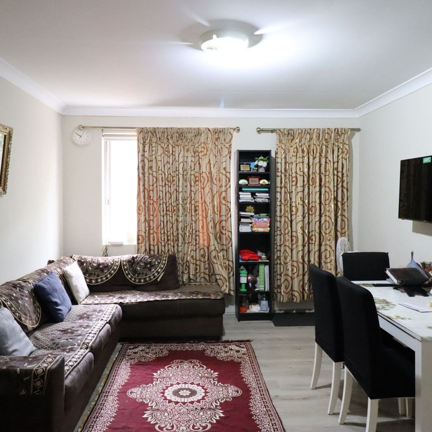 Top Floor 2 bedroom unit with Lock Up Garage - Photo 1